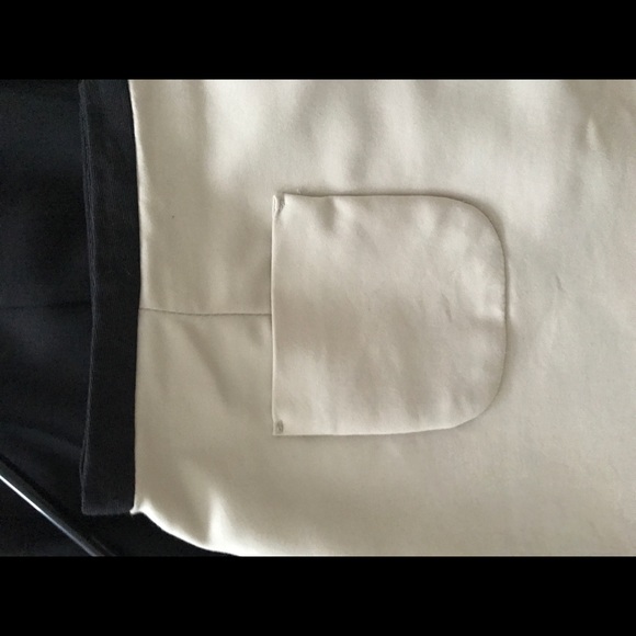 Creme coloured mini skirt with black trim on waist - Picture 3 of 3